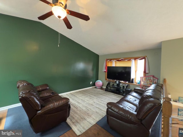  - living room featuring ceiling fan, vaulted ceiling, and baseboards
