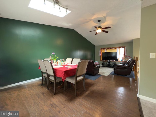  - dining area featuring ceiling fan, wood finished floors, lofted ceiling, and baseboards