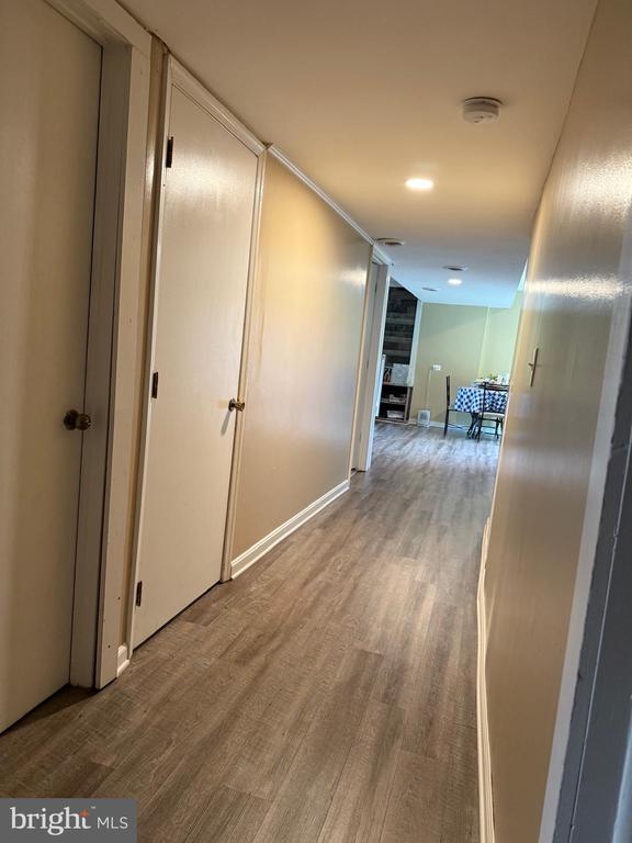  - hall with wood finished floors and baseboards