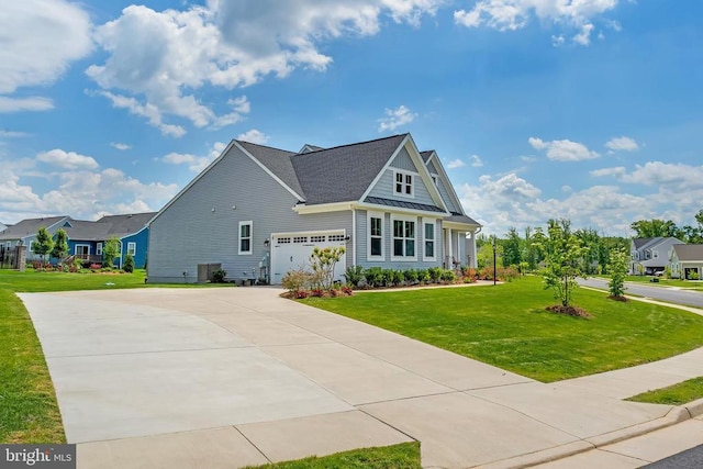 view of front of house featuring concrete driveway, a front lawn, a standing seam roof, and a garage