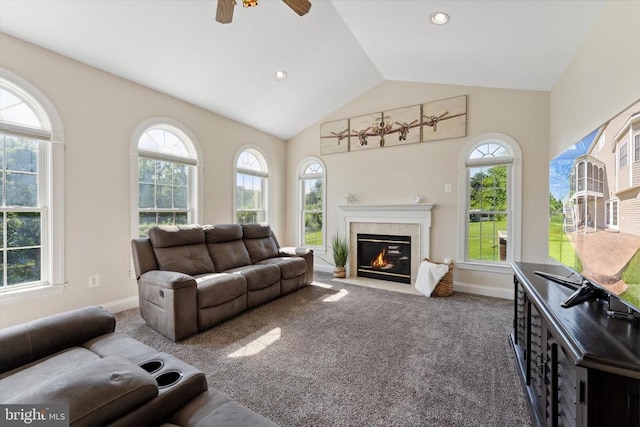 living room featuring carpet flooring, lofted ceiling, a fireplace, and baseboards