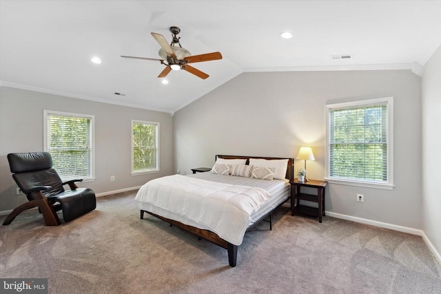 bedroom with multiple windows, carpet flooring, crown molding, baseboards, and lofted ceiling
