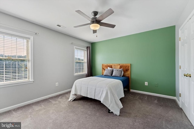 bedroom with carpet floors, baseboards, and ceiling fan