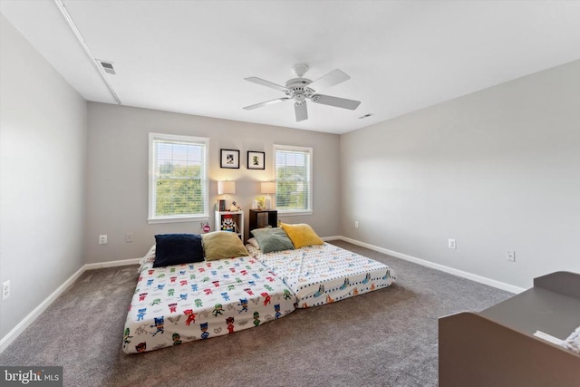 carpeted bedroom with baseboards and a ceiling fan