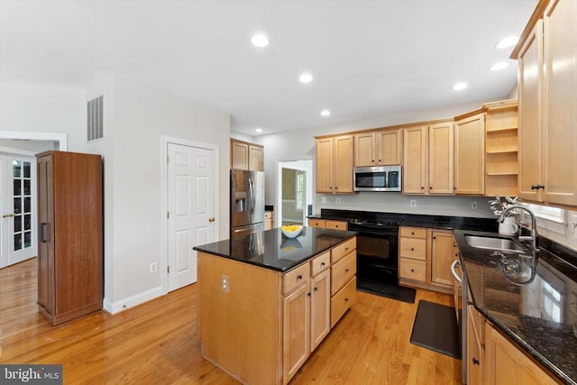 kitchen with stainless steel appliances, a sink, open shelves, a center island, and light brown cabinetry