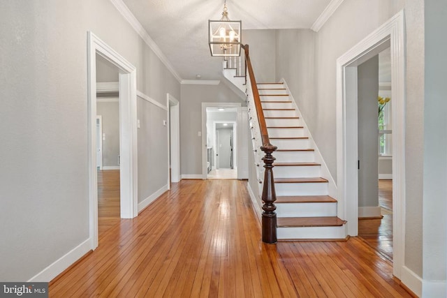 105 E Washington St, Remington, VA 22734 - entryway with hardwood / wood-style floors, a chandelier, stairway, and ornamental molding