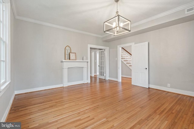105 E Washington St, Remington, VA 22734 - unfurnished living room with a chandelier, stairs, light wood-type flooring, and crown molding