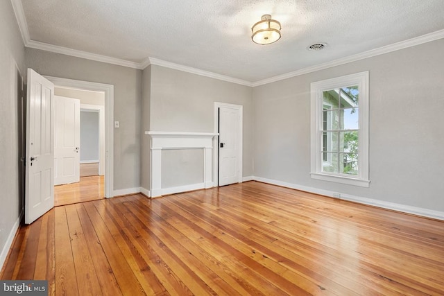 105 E Washington St, Remington, VA 22734 - spare room featuring light wood-style flooring, a textured ceiling, and ornamental molding