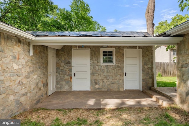 105 E Washington St, Remington, VA 22734 - property entrance featuring stone siding and a metal roof