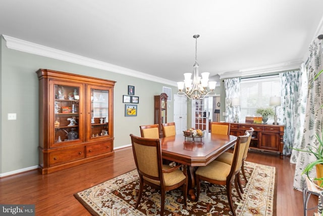 6020 E Greenbrier River Rd E, Fredericksburg, VA 22407 - dining room with a chandelier, crown molding, dark wood-type flooring, and baseboards