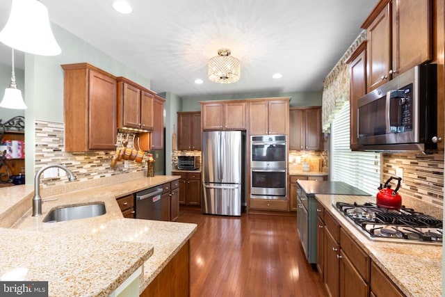 6020 E Greenbrier River Rd E, Fredericksburg, VA 22407 - kitchen featuring appliances with stainless steel finishes, a sink, light stone countertops, tasteful backsplash, and recessed lighting