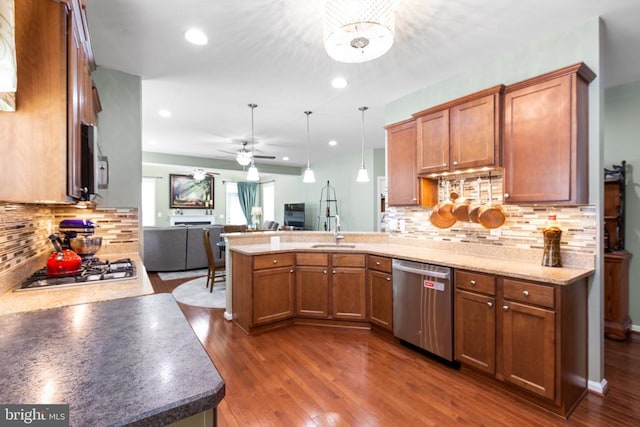 6020 E Greenbrier River Rd E, Fredericksburg, VA 22407 - kitchen with appliances with stainless steel finishes, a peninsula, brown cabinetry, open floor plan, and a sink