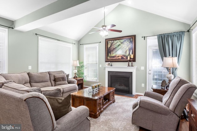 6020 E Greenbrier River Rd E, Fredericksburg, VA 22407 - living room with vaulted ceiling, ceiling fan, a fireplace with flush hearth, and baseboards