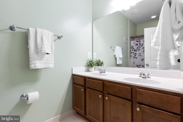 6020 E Greenbrier River Rd E, Fredericksburg, VA 22407 - full bath with double vanity, tile patterned flooring, and baseboards