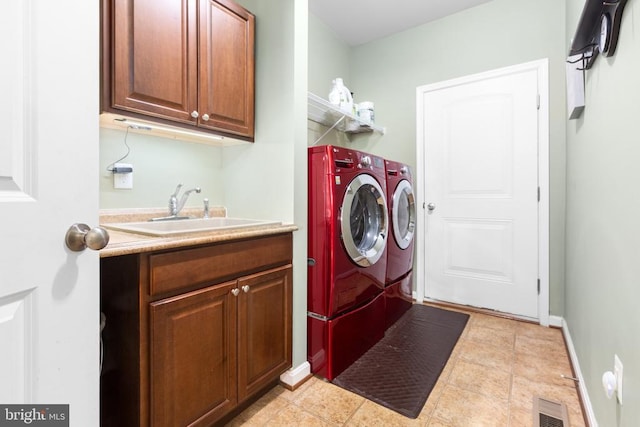 6020 E Greenbrier River Rd E, Fredericksburg, VA 22407 - laundry area with washing machine and clothes dryer, cabinet space, and baseboards