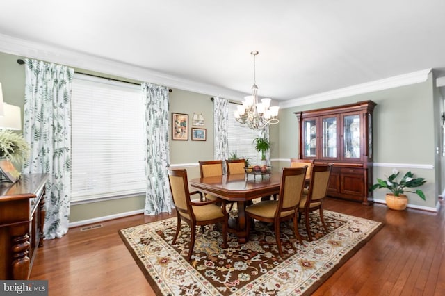 6020 E Greenbrier River Rd E, Fredericksburg, VA 22407 - dining room featuring a chandelier, crown molding, wood finished floors, and baseboards