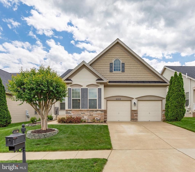 6020 E Greenbrier River Rd E, Fredericksburg, VA 22407 - craftsman-style house featuring a standing seam roof, a front lawn, driveway, stone siding, and metal roof