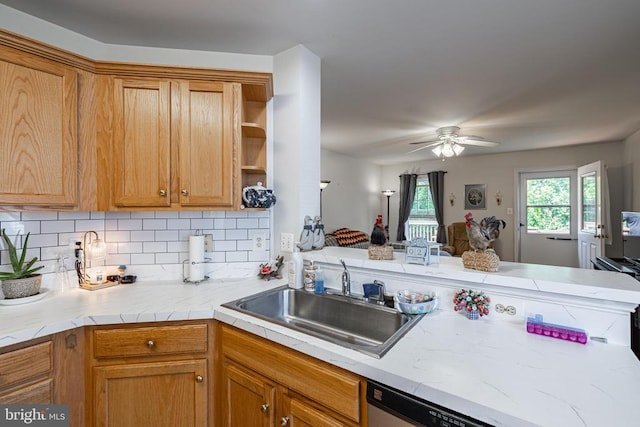 kitchen featuring a sink, open shelves, light countertops, ceiling fan, and backsplash