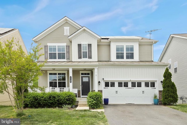 1708 Hudgins Farm Cir, Fredericksburg, VA 22408 - traditional-style home featuring a porch, an attached garage, asphalt driveway, board and batten siding, and a standing seam roof