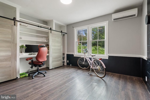 404 N Franklin St, Remington, VA 22734 - office featuring a barn door, a wall unit AC, wood finished floors, and wainscoting
