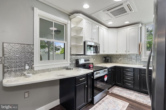 404 N Franklin St, Remington, VA 22734 - kitchen with appliances with stainless steel finishes, white cabinets, dark cabinets, decorative backsplash, and dark wood-style floors