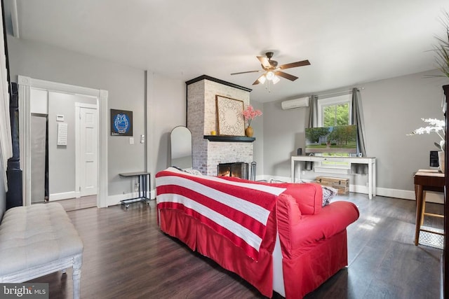 404 N Franklin St, Remington, VA 22734 - living room with a ceiling fan, wood finished floors, a stone fireplace, and an AC wall unit