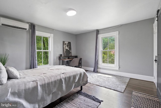 404 N Franklin St, Remington, VA 22734 - bedroom featuring a wall mounted air conditioner, multiple windows, and wood finished floors