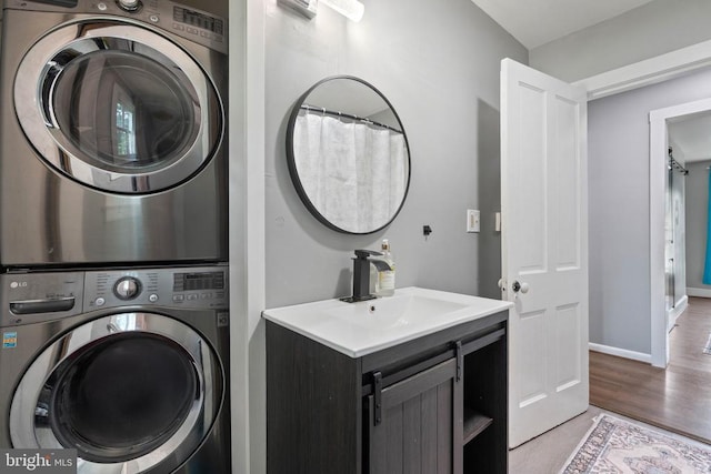 404 N Franklin St, Remington, VA 22734 - washroom with stacked washer and clothes dryer and light wood finished floors
