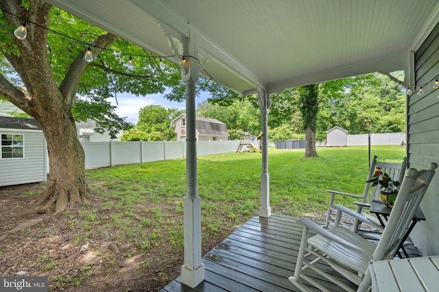 404 N Franklin St, Remington, VA 22734 - wooden deck featuring a playground and a fenced backyard
