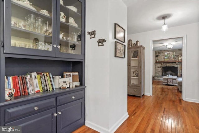  - hall with light wood-style flooring and baseboards