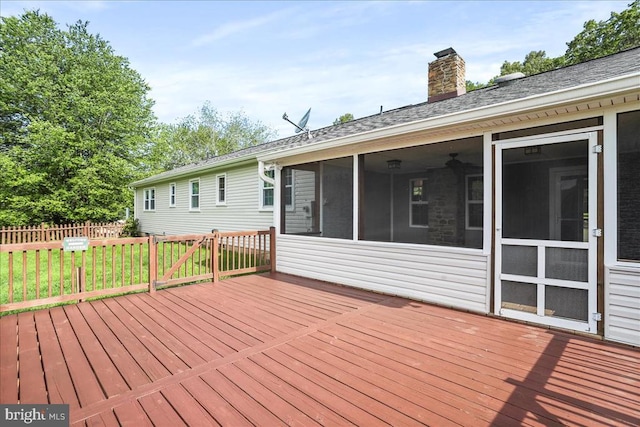  - deck featuring a sunroom