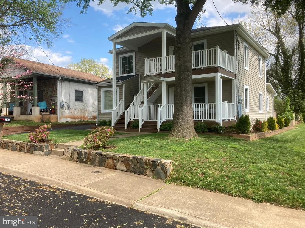716 1st St, Charlottesville, VA 22902 - view of front of property featuring a balcony, a front yard, and covered porch