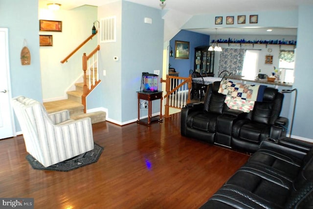  - living area with wood finished floors and stairs