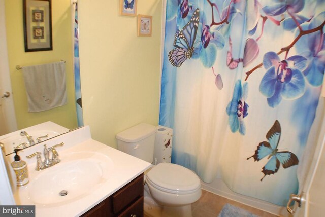  - bathroom with vanity, curtained shower, and tile patterned floors