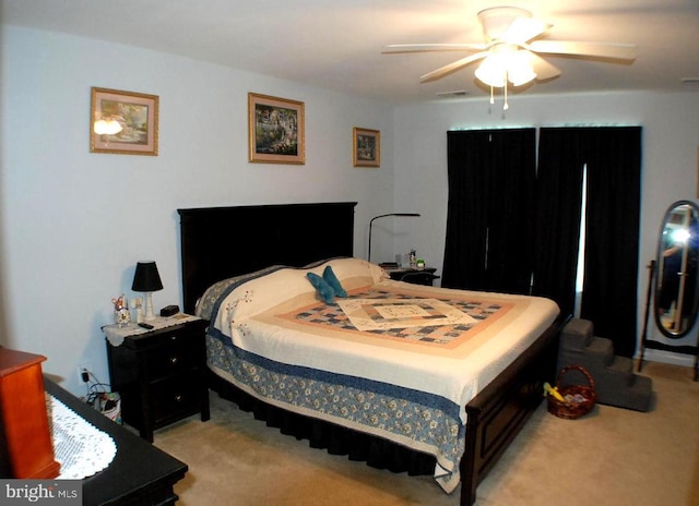  - bedroom with light carpet and ceiling fan