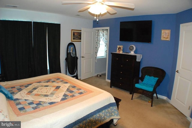  - carpeted bedroom with baseboards and a ceiling fan