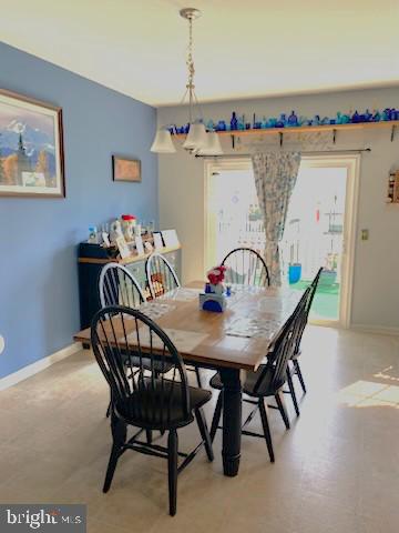  - dining room featuring baseboards