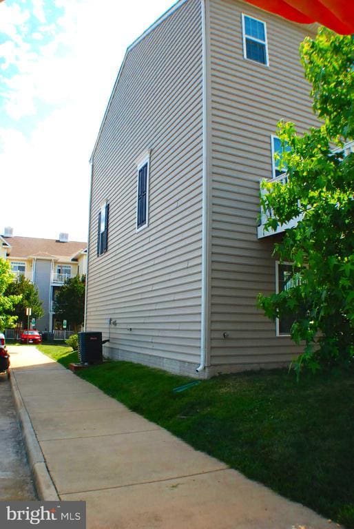  - view of property exterior with a cooling unit