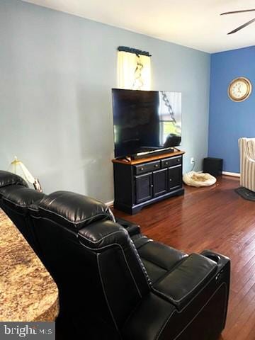  - living room featuring dark wood-style flooring and a ceiling fan