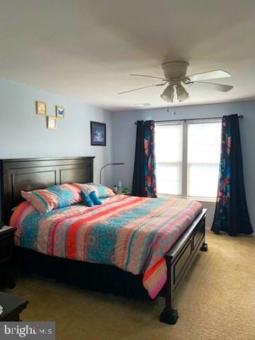  - bedroom featuring light colored carpet and ceiling fan