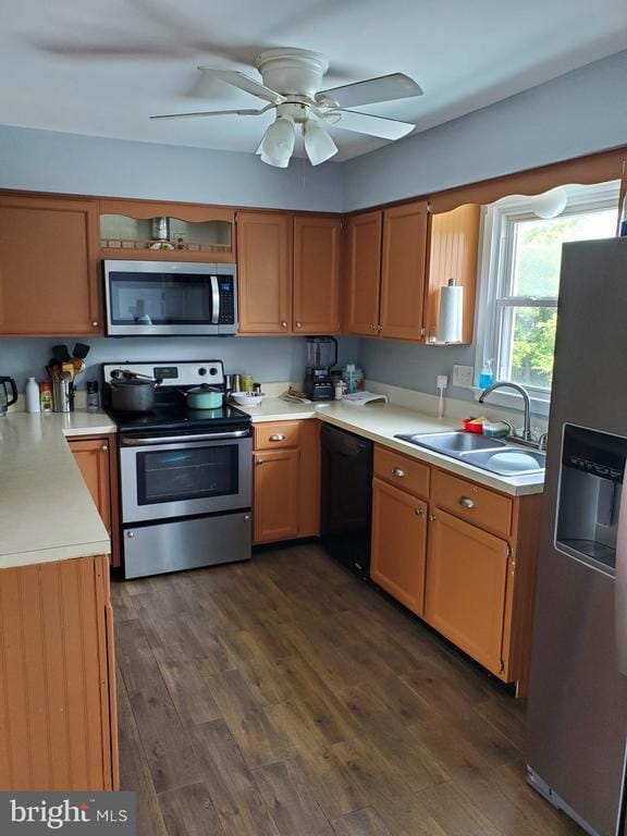  - kitchen with stainless steel appliances, dark wood-style floors, light countertops, and ceiling fan