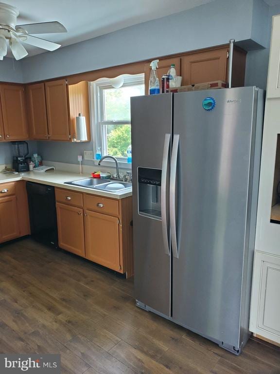 - kitchen with stainless steel fridge with ice dispenser, dishwasher, light countertops, a ceiling fan, and dark wood finished floors