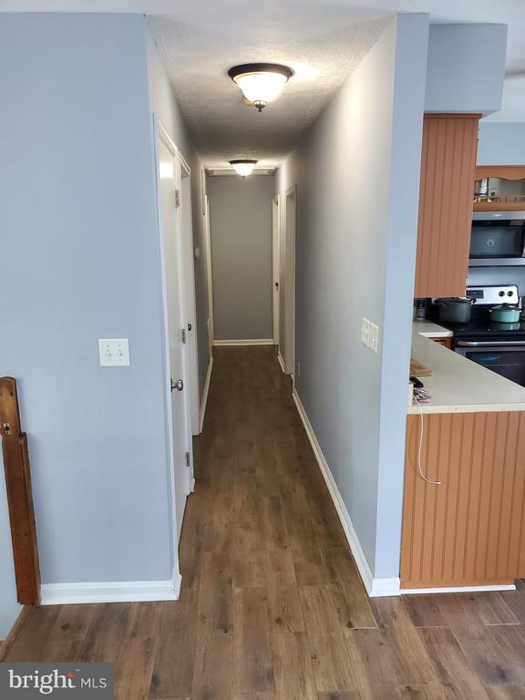  - corridor with wood finished floors