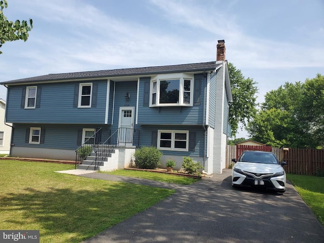  - split foyer home featuring a chimney