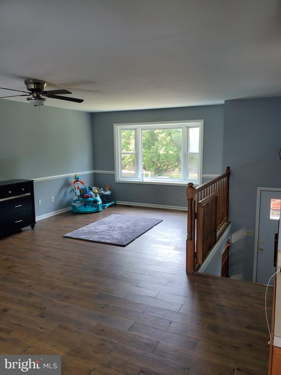  - rec room featuring wood finished floors and a ceiling fan