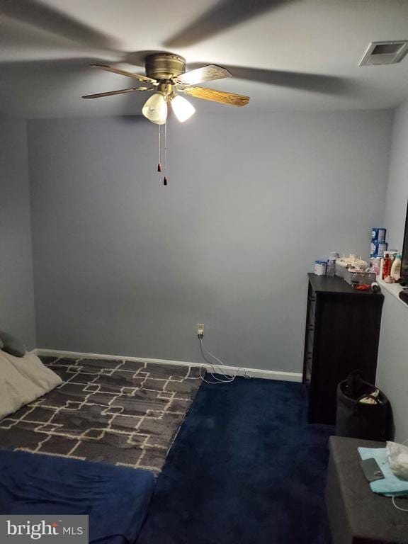  - carpeted bedroom featuring baseboards and a ceiling fan