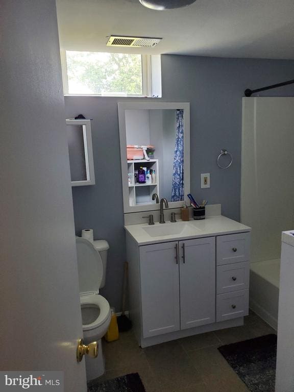  - bathroom with vanity, shower / washtub combination, and tile patterned floors
