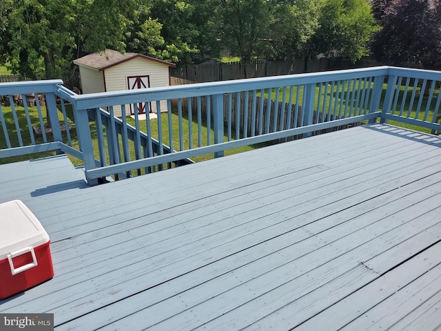  - deck with a fenced backyard and a storage unit