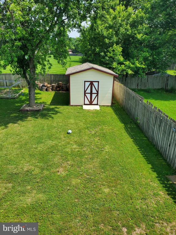  - fenced backyard with a shed