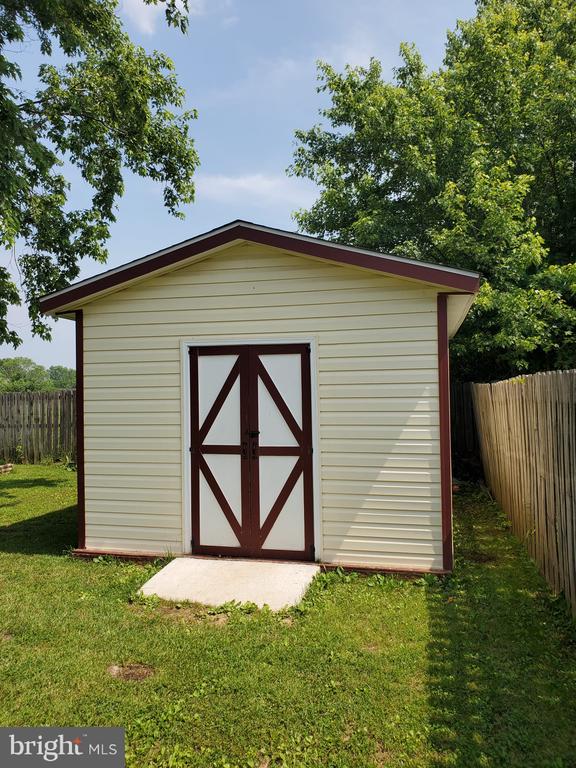  - view of shed featuring a fenced backyard